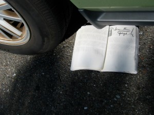 Tire tracks on book after being run over
